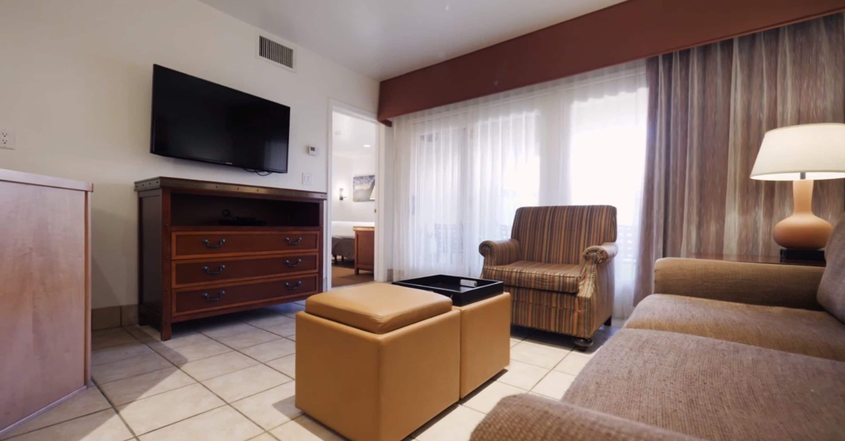 standard suite, 2 bedrooms | living room | 27-inch tv with cable channels, dvd player