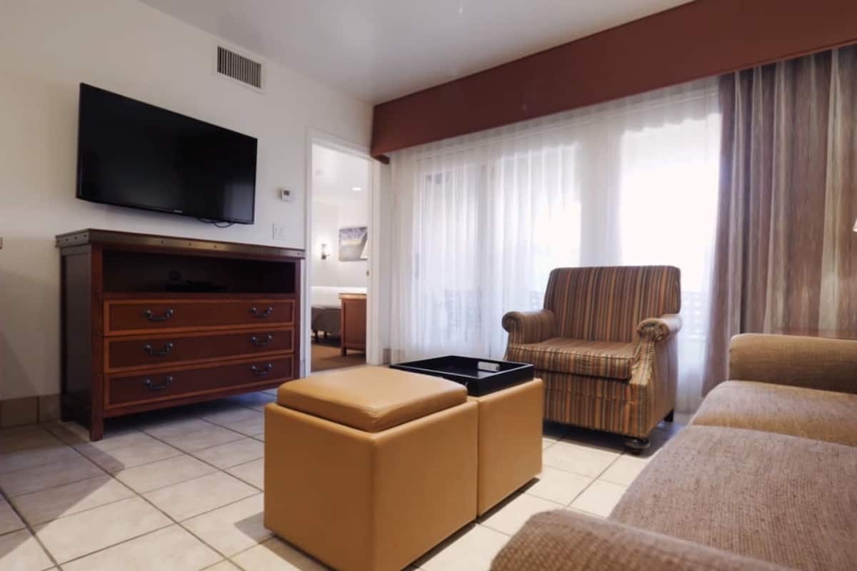 standard suite, 2 bedrooms | living room | 27-inch tv with cable channels, dvd player
