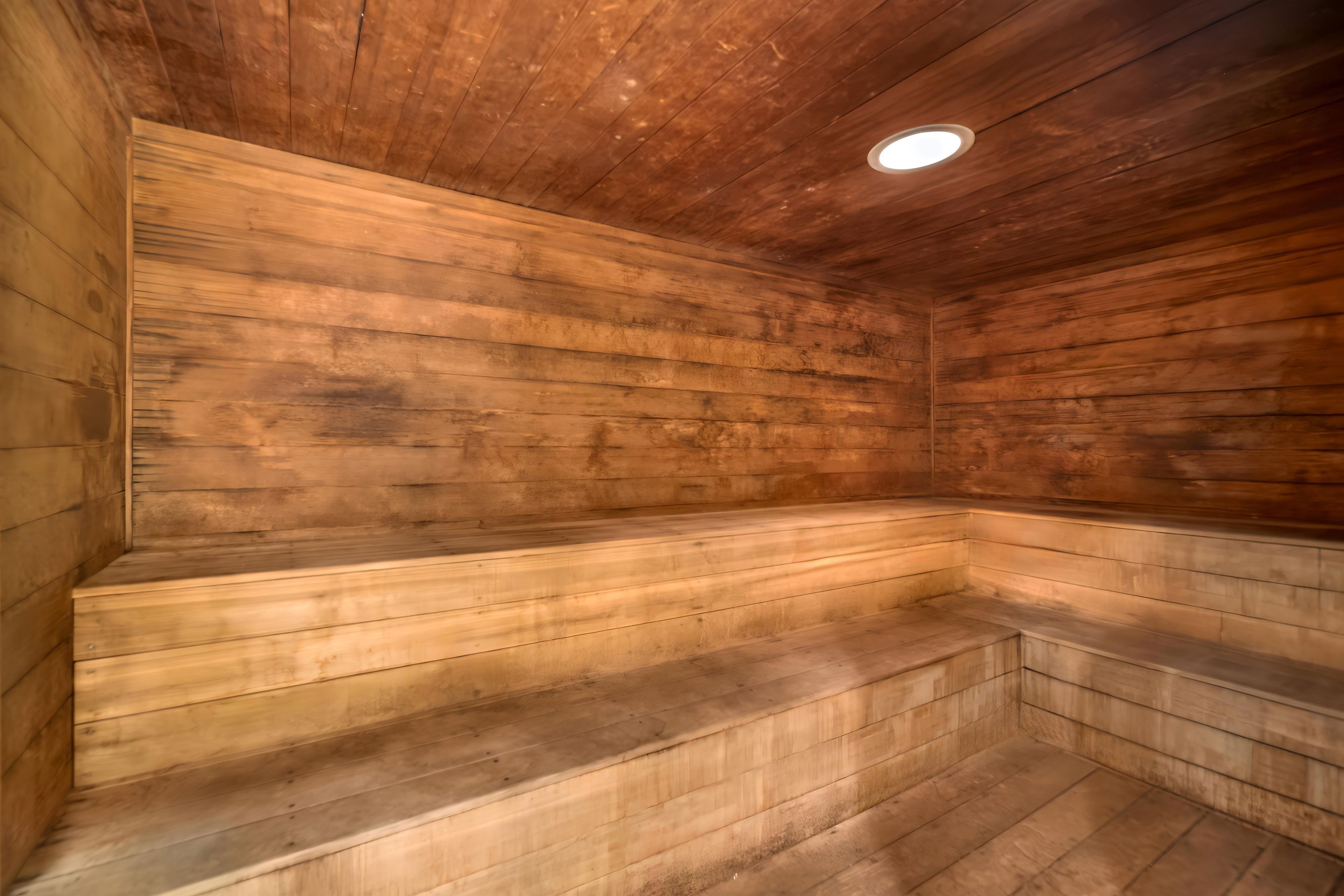 A sauna with wooden walls and benches.