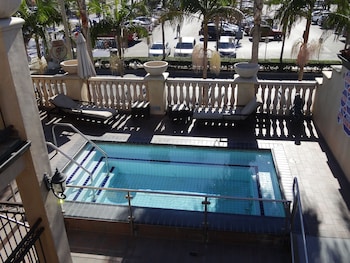 Outdoor pool, open 8 AM to 11 PM, pool umbrellas, sun loungers at Balboa Inn, On the Beach