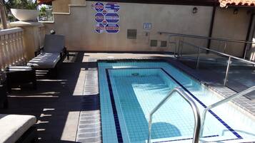 Outdoor pool, open 8 AM to 11 PM, pool umbrellas, sun loungers