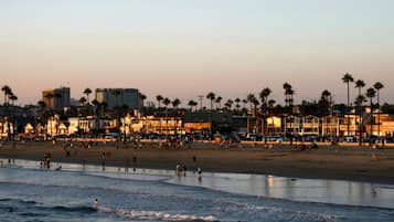 On the beach, white sand, beach towels, beach volleyball