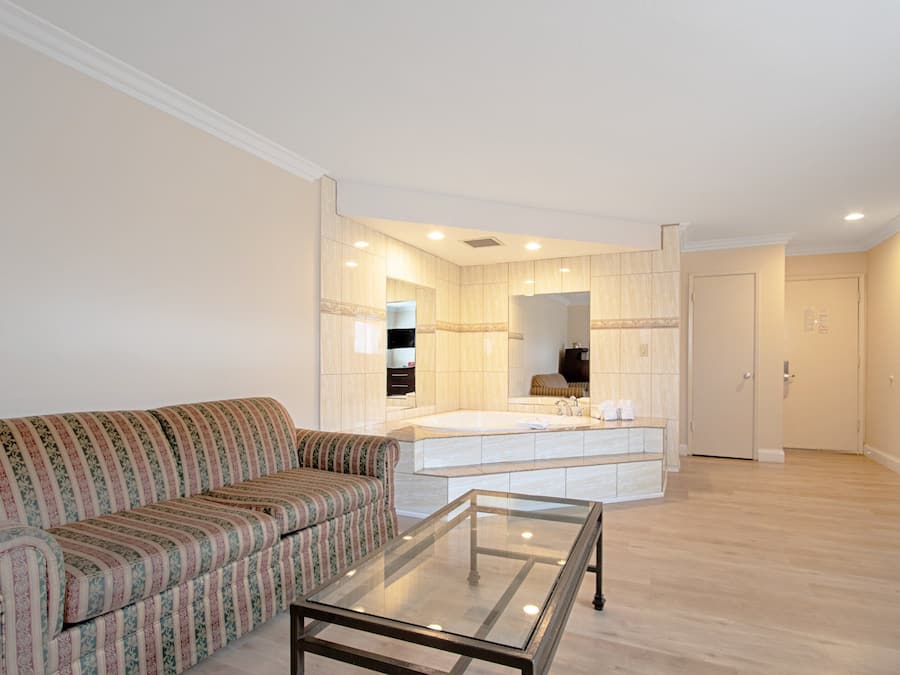 Suite, Non Smoking, Jetted Tub (2 King Beds) | Desk, blackout curtains, iron/ironing board, free cots/infant beds