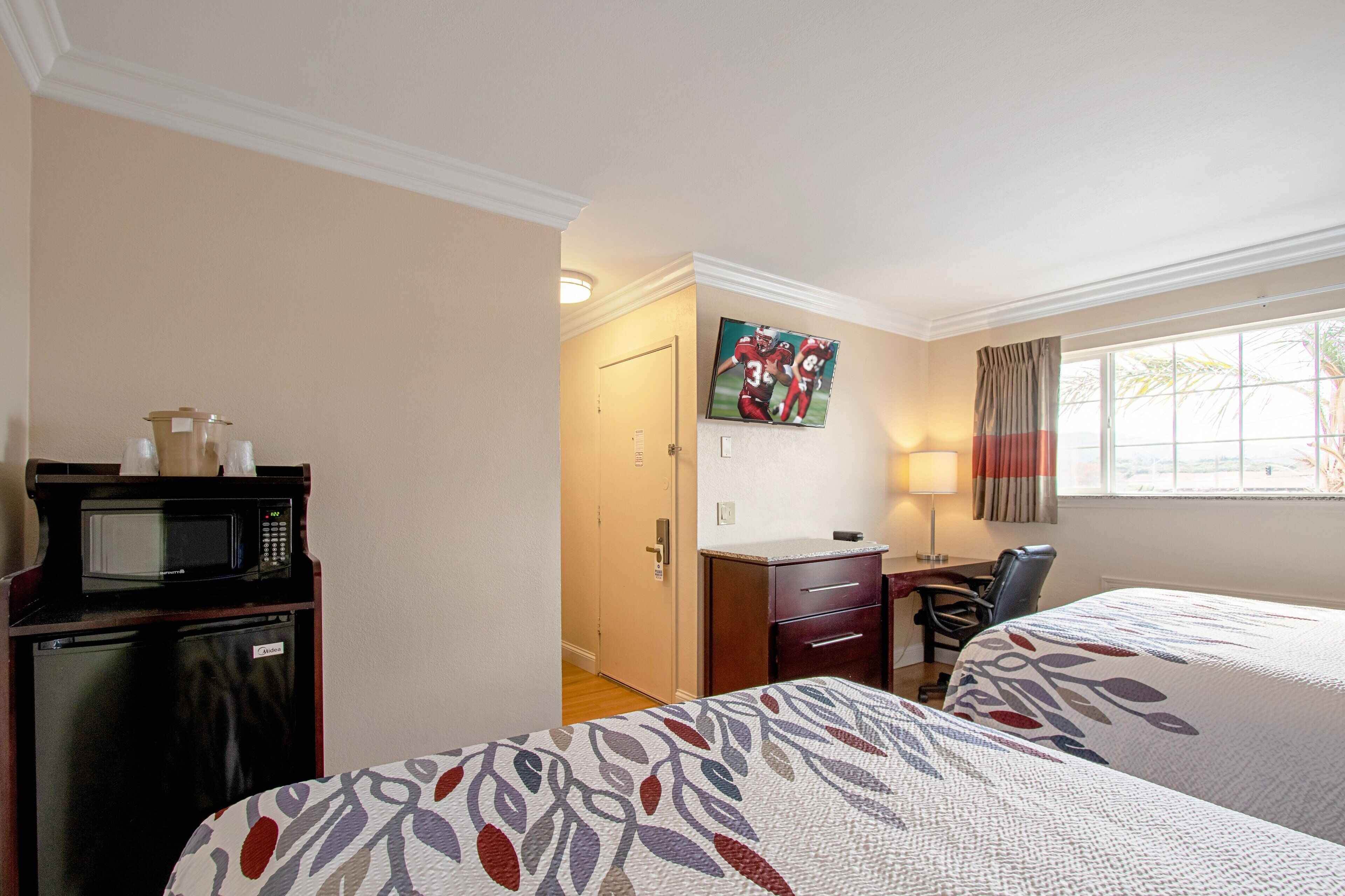 desk, blackout curtains, iron/ironing board, free cots/infant beds