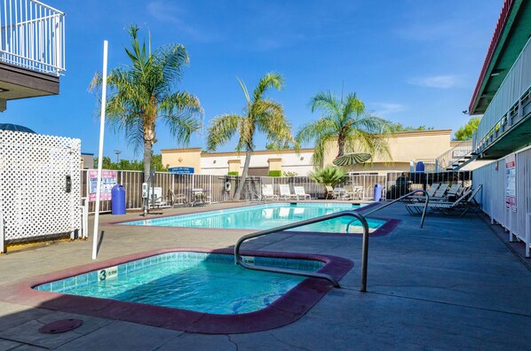 Seasonal outdoor pool, open 9:00 AM to 9:00 PM, pool loungers