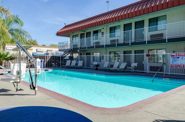 Seasonal outdoor pool, open 9:00 AM to 9:00 PM, pool loungers