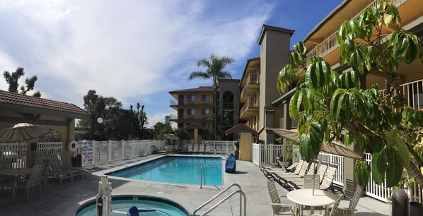 Outdoor pool, open 9:30 AM to 9:00 PM, pool loungers