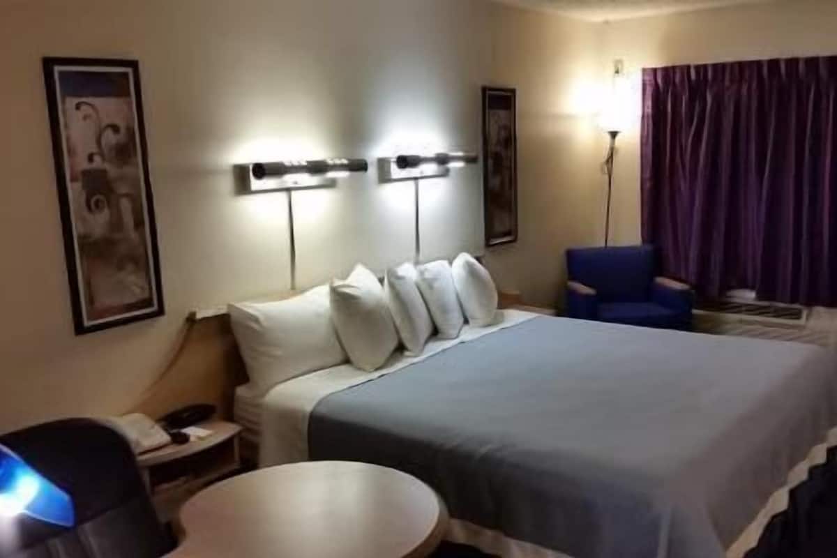 Pillowtop beds, desk, blackout drapes, iron/ironing board
