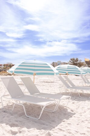 Private beach, beach cabanas, beach towels, beach volleyball