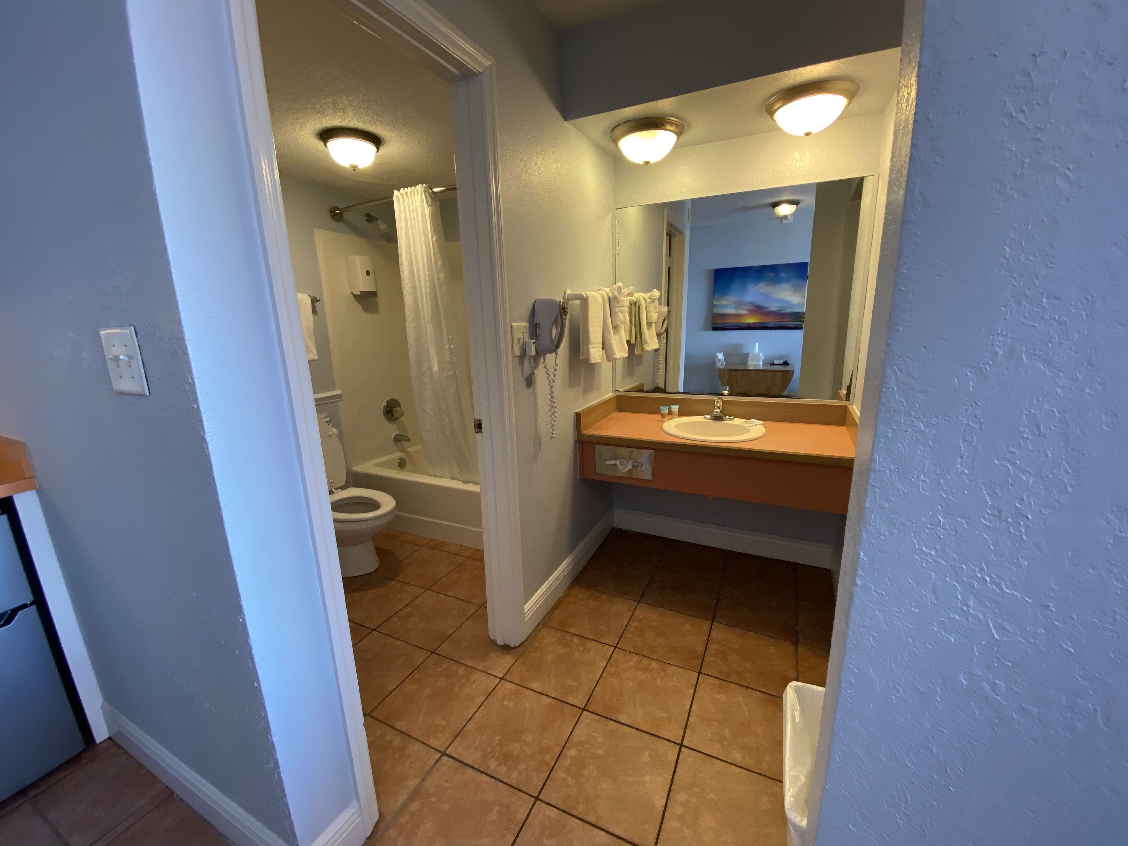 standard room, 2 queen beds, kitchenette, ocean view | bathroom | shower, hair dryer, towels, soap