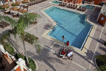 2 outdoor pools, pool umbrellas, sun loungers at Westgate Towers Resort
