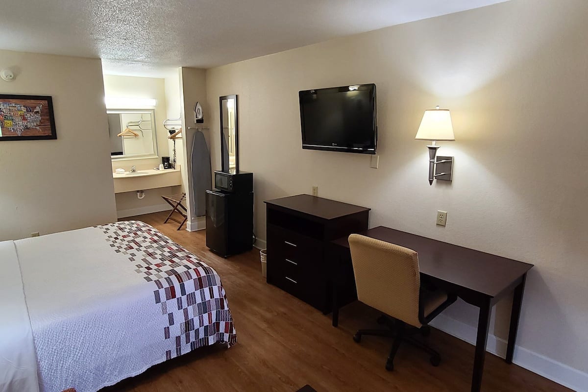 Premium bedding, desk, laptop workspace, iron/ironing board