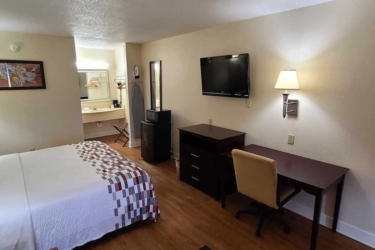 Premium bedding, desk, laptop workspace, iron/ironing board