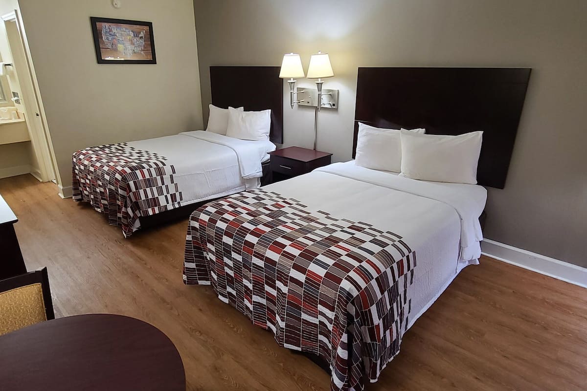 Premium bedding, desk, laptop workspace, iron/ironing board