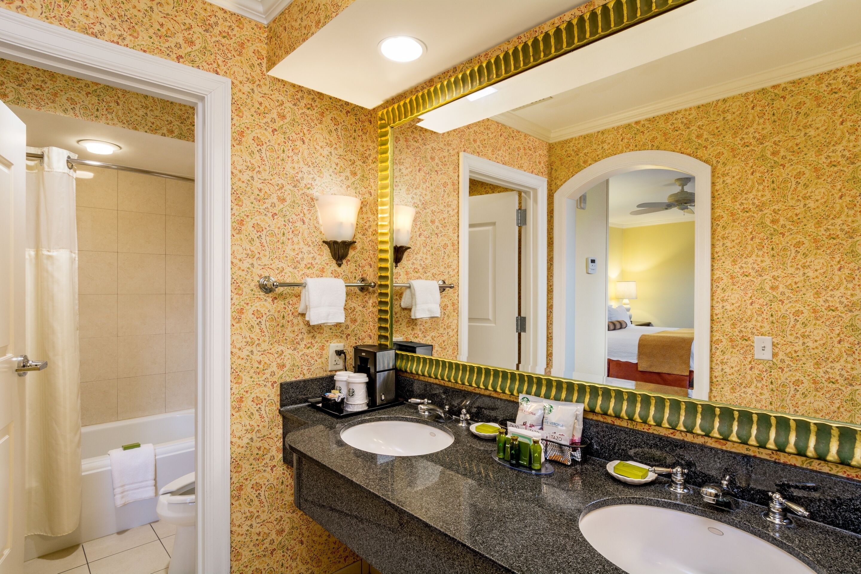 combined shower/bathtub, designer toiletries, hair dryer, towels