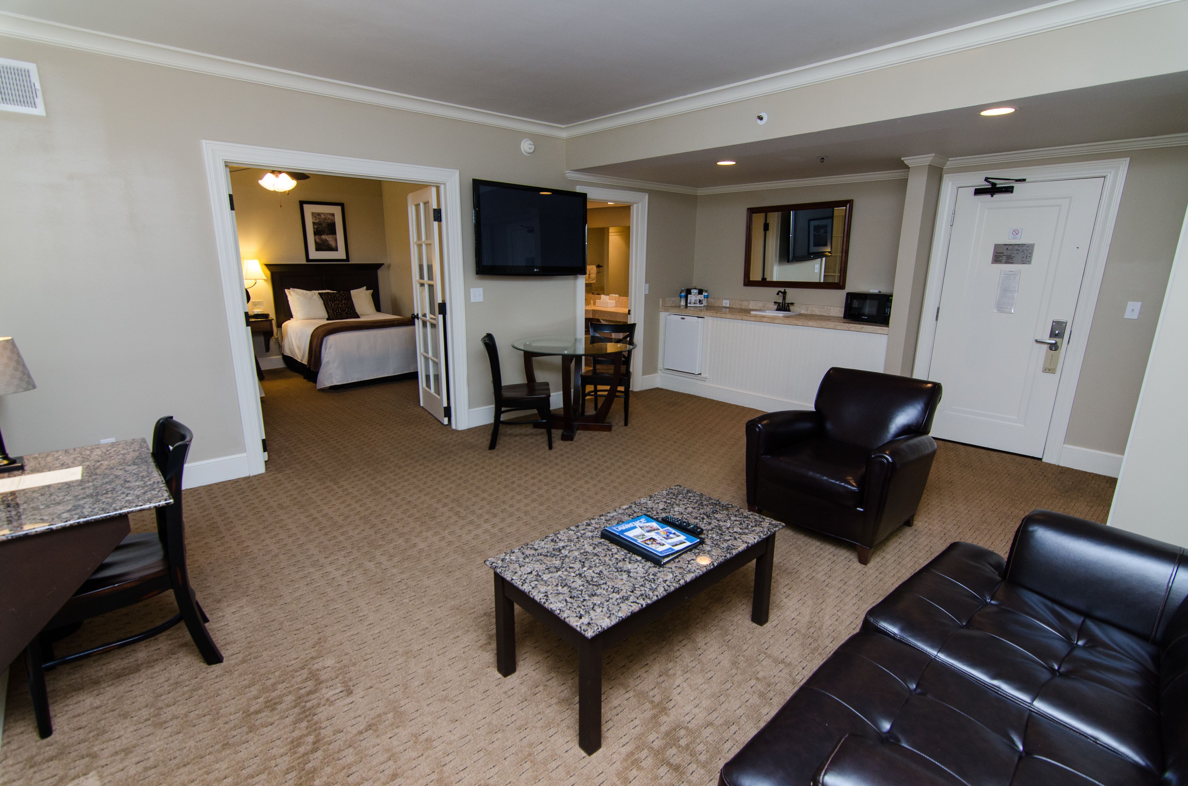 premier room, 2 double beds, non smoking | living area | 50-inch flat-screen tv with cable channels, tv