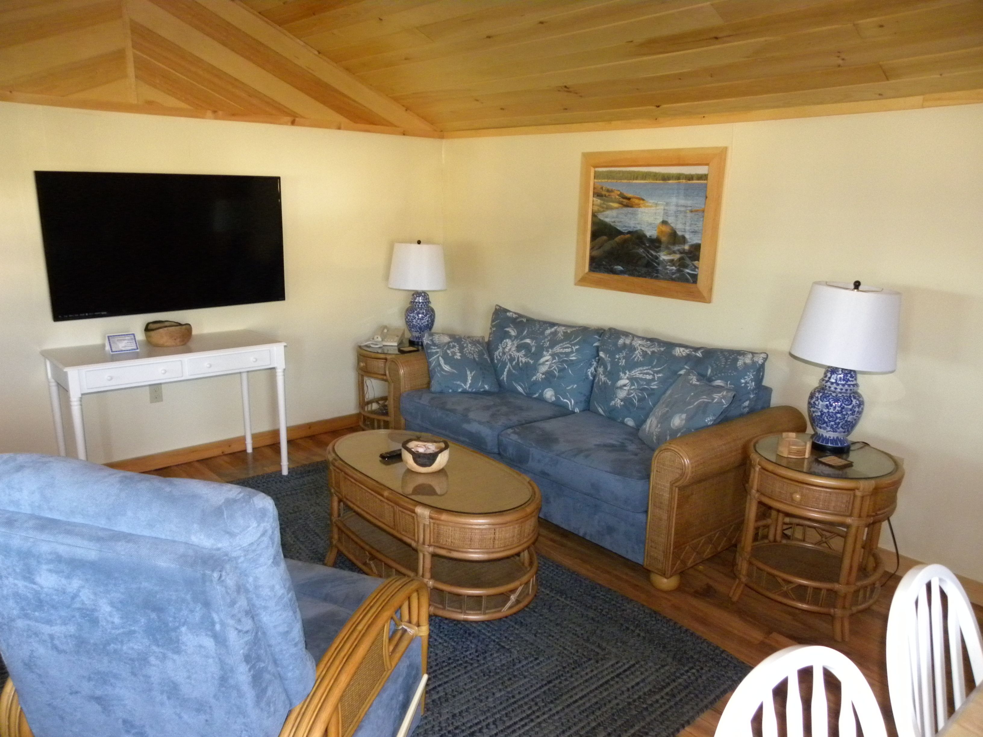 deluxe cottage, 1 bedroom, kitchen, ocean view | living room | 85-inch smart tv with cable channels
