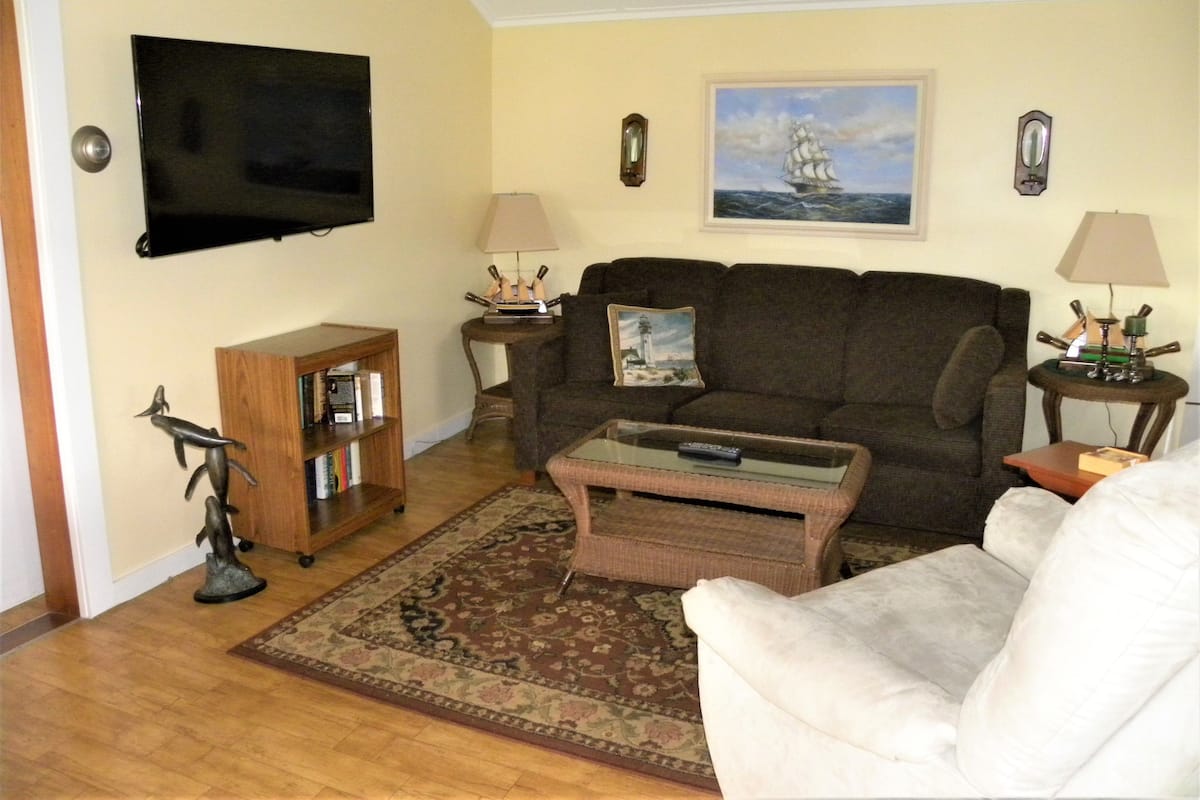 Deluxe Cottage, 1 Bedroom, Kitchenette, Ocean View | 1 bedroom, blackout drapes, soundproofing, iron/ironing board