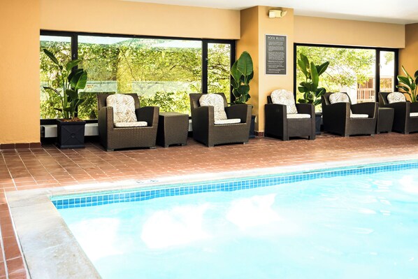 Indoor pool, open 7:00 AM to 10:00 PM, pool loungers