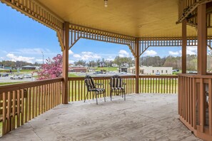 Relax in this serene outdoor space with a comfortable seating area and a view of the surrounding cityscape.