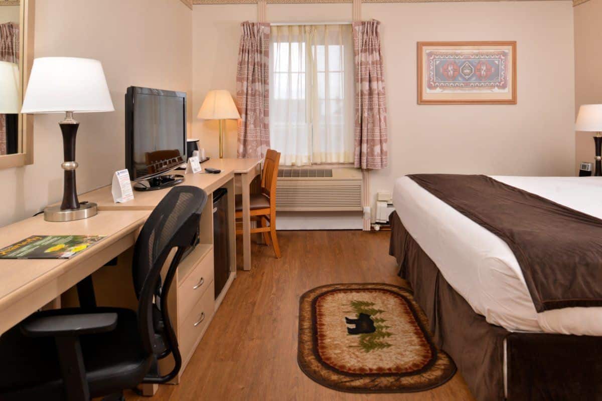 standard room (historic king bed) | premium bedding, desk, laptop workspace, blackout curtains