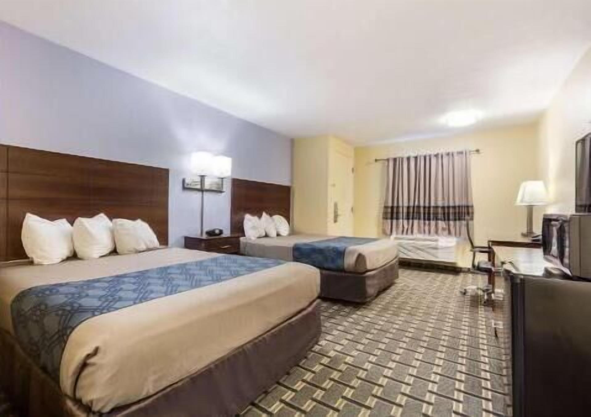 Premium bedding, desk, laptop workspace, iron/ironing board