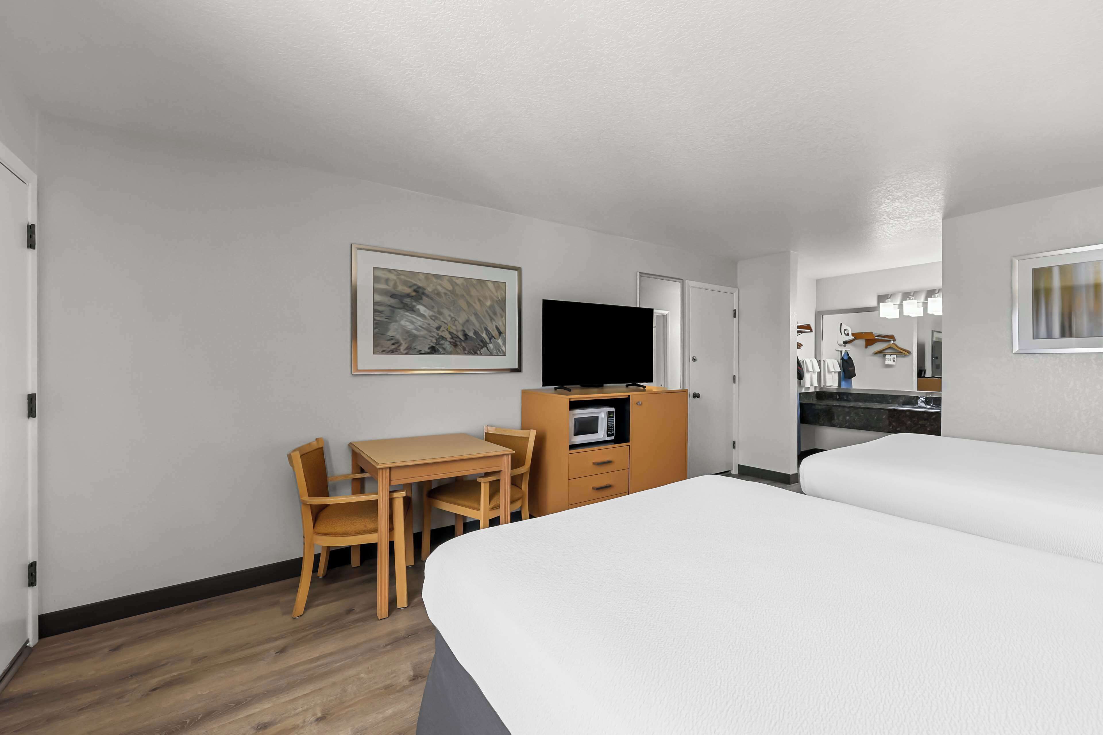 standard room, 2 queen beds, non smoking (pet friendly) | in-room safe, desk, blackout curtains, iron/ironing board