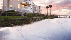 A beachfront hotel with multiple balconies and a view of the ocean. - Club Wyndham Ocean Ridge (Edisto Island)