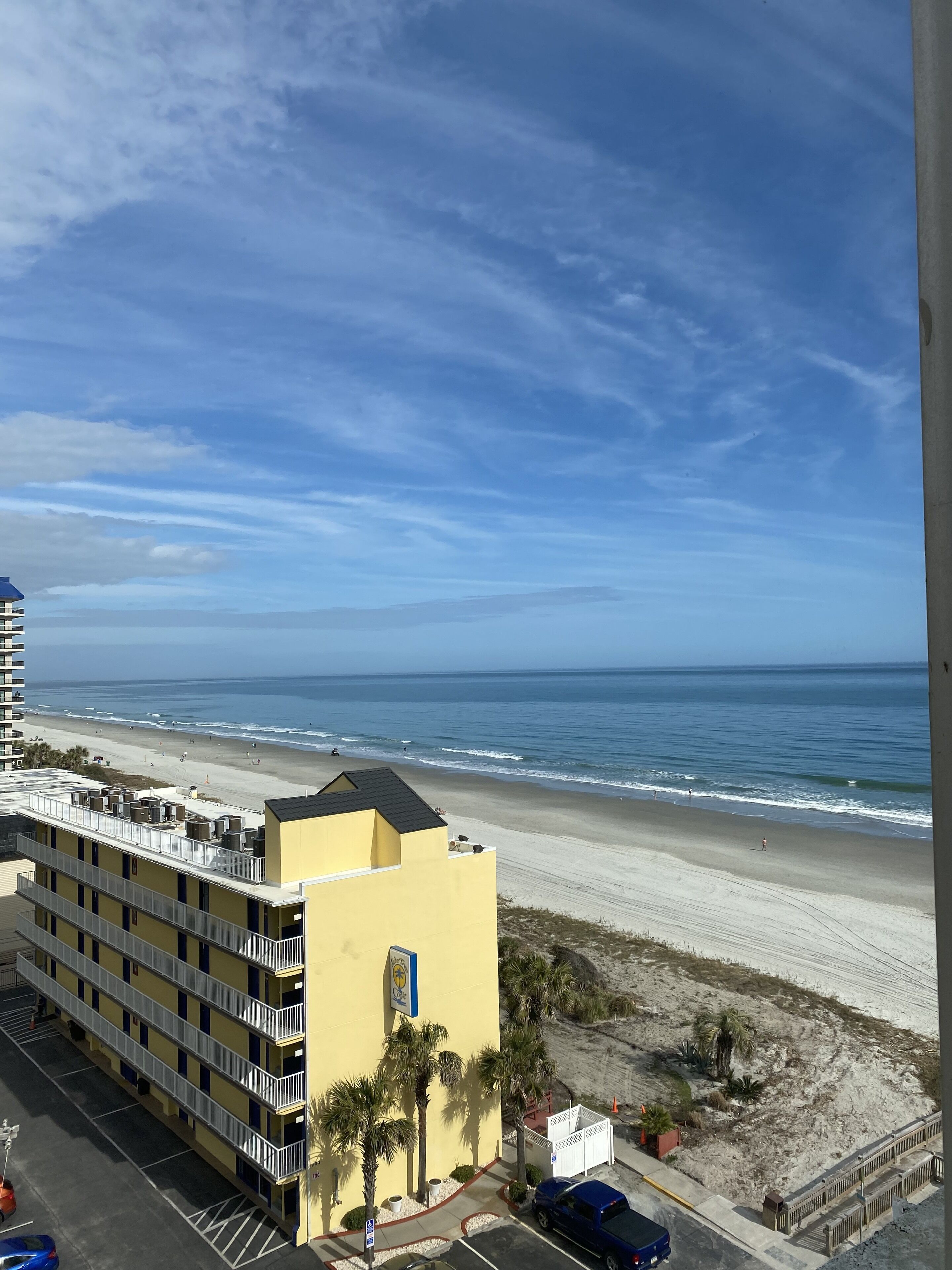 A hotel with a view of the beach and ocean.