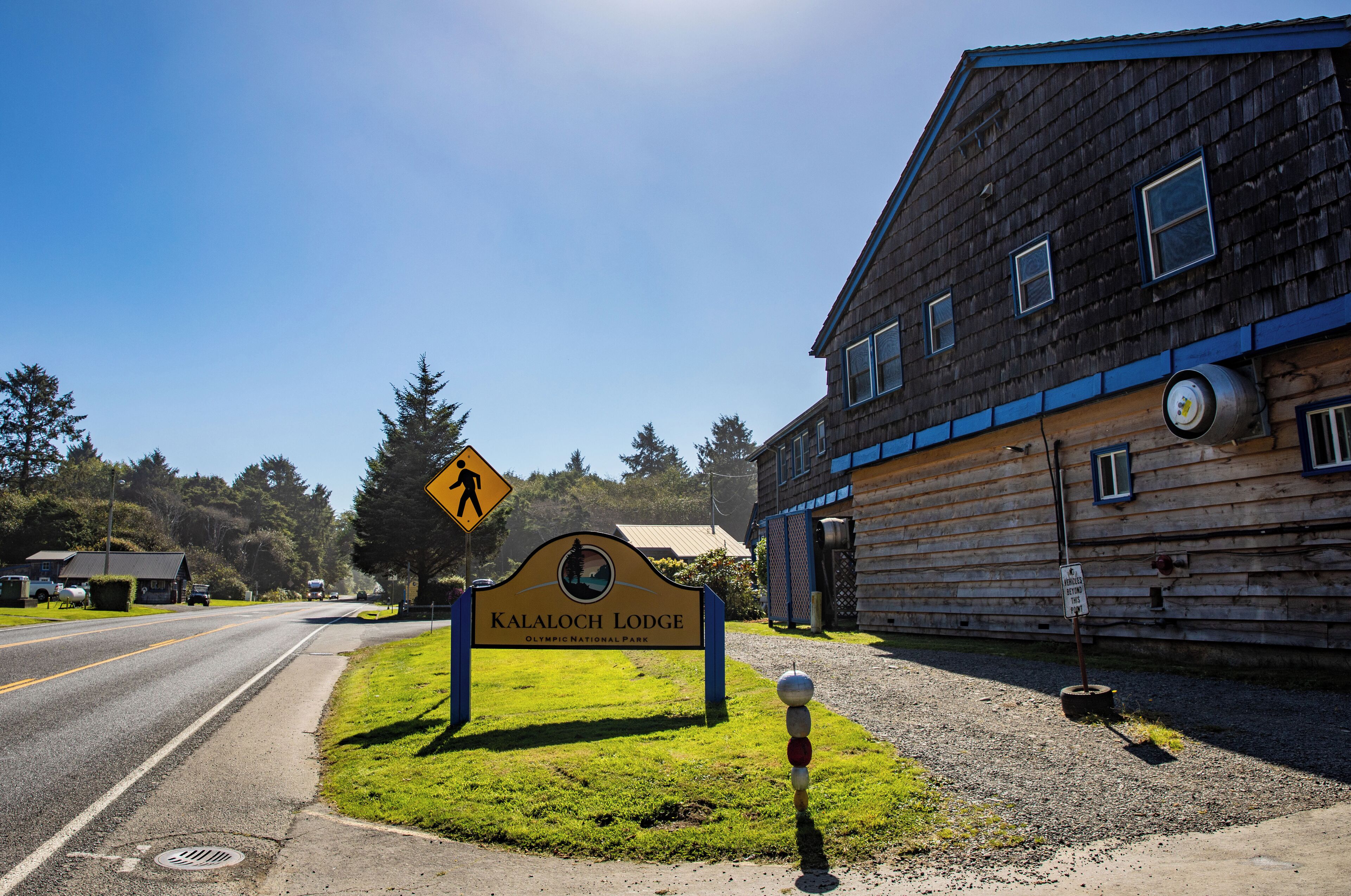 A wooden building with a sign reading "KALALOCH LODGE Olympic National Park".