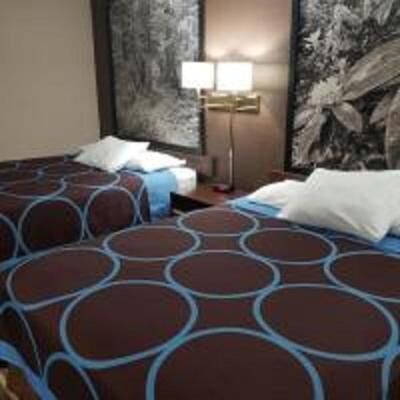 Desk, laptop workspace, blackout drapes, cribs/infant beds