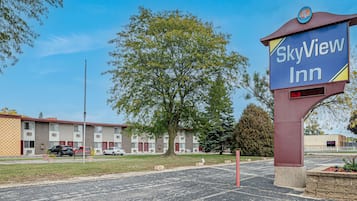 SkyView Inn features a modern design with a flat roof and a combination of brick and siding.