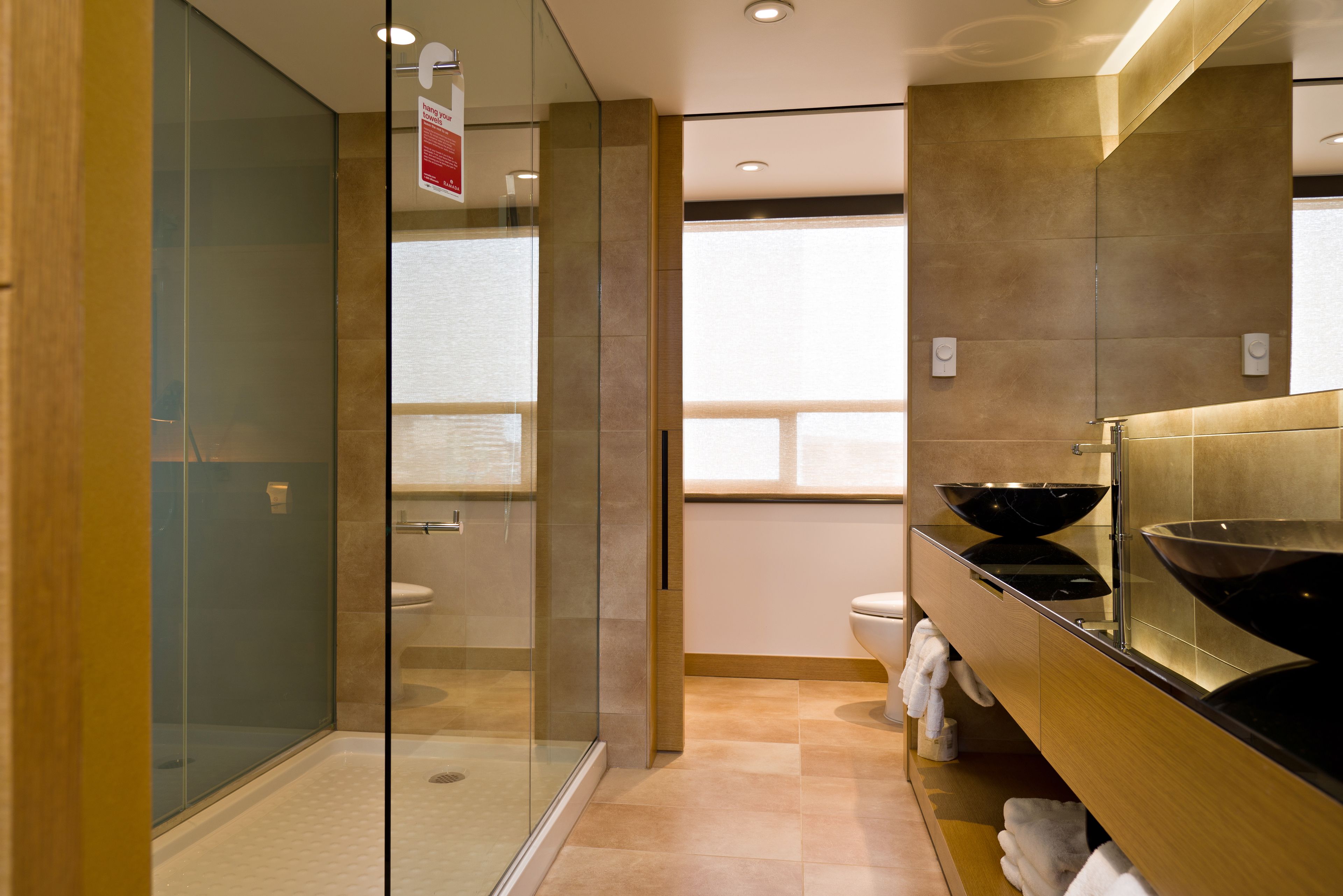 executive suite, 1 king bed (longterm suite) | bathroom | free toiletries, hair dryer, heated floors, towels