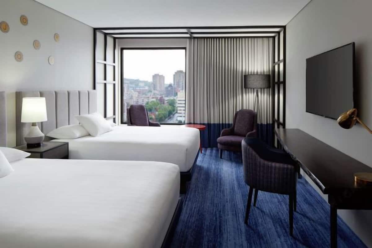 Premium bedding, pillow-top beds, in-room safe, laptop workspace