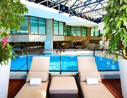 Indoor pool, open 9:00 AM to 8:00 PM, pool umbrellas, sun loungers