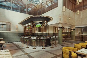 A bar area with a circular seating arrangement, a clock, and a television screen.