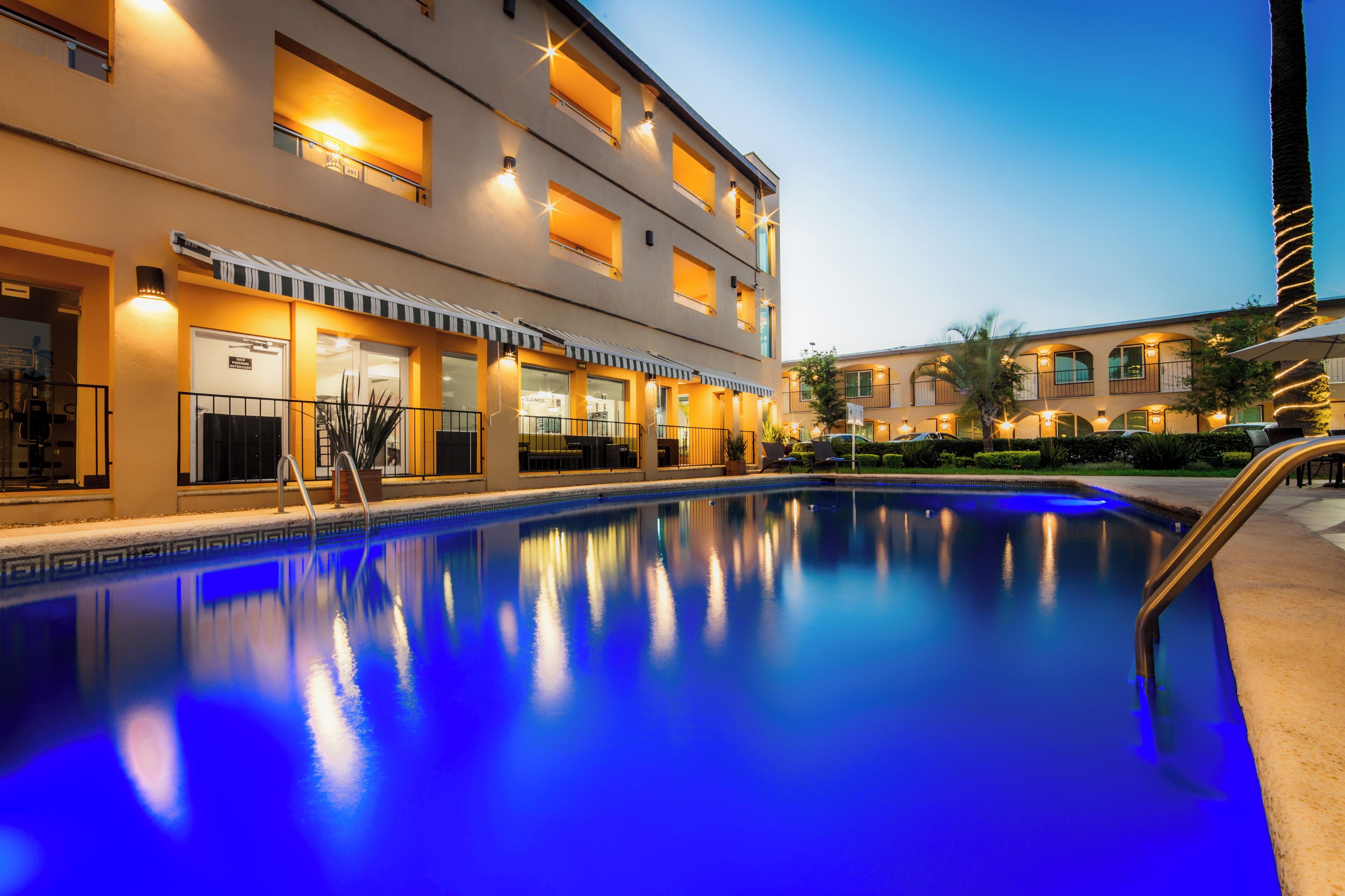 Outdoor pool, open 7 AM to 10 PM, pool umbrellas, sun loungers