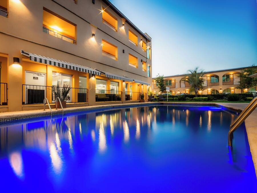 Outdoor pool, open 7 AM to 10 PM, pool umbrellas, pool loungers