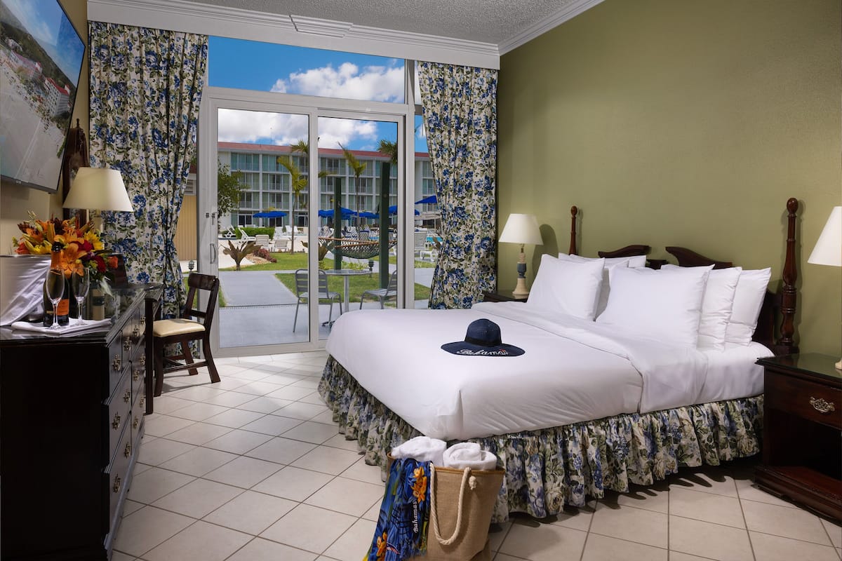 room, patio, pool view | hypo-allergenic bedding, in-room safe, desk, laptop workspace