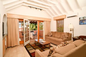 Studio Suite, 1 Bedroom | Living area | 32-inch flat-screen TV with cable channels, TV