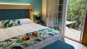Deluxe Room, 1 King Bed | In-room safe, iron/ironing board, free cribs/infant beds, free WiFi