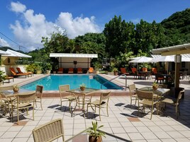 Outdoor pool, open 11:00 AM to 6:30 PM, pool umbrellas