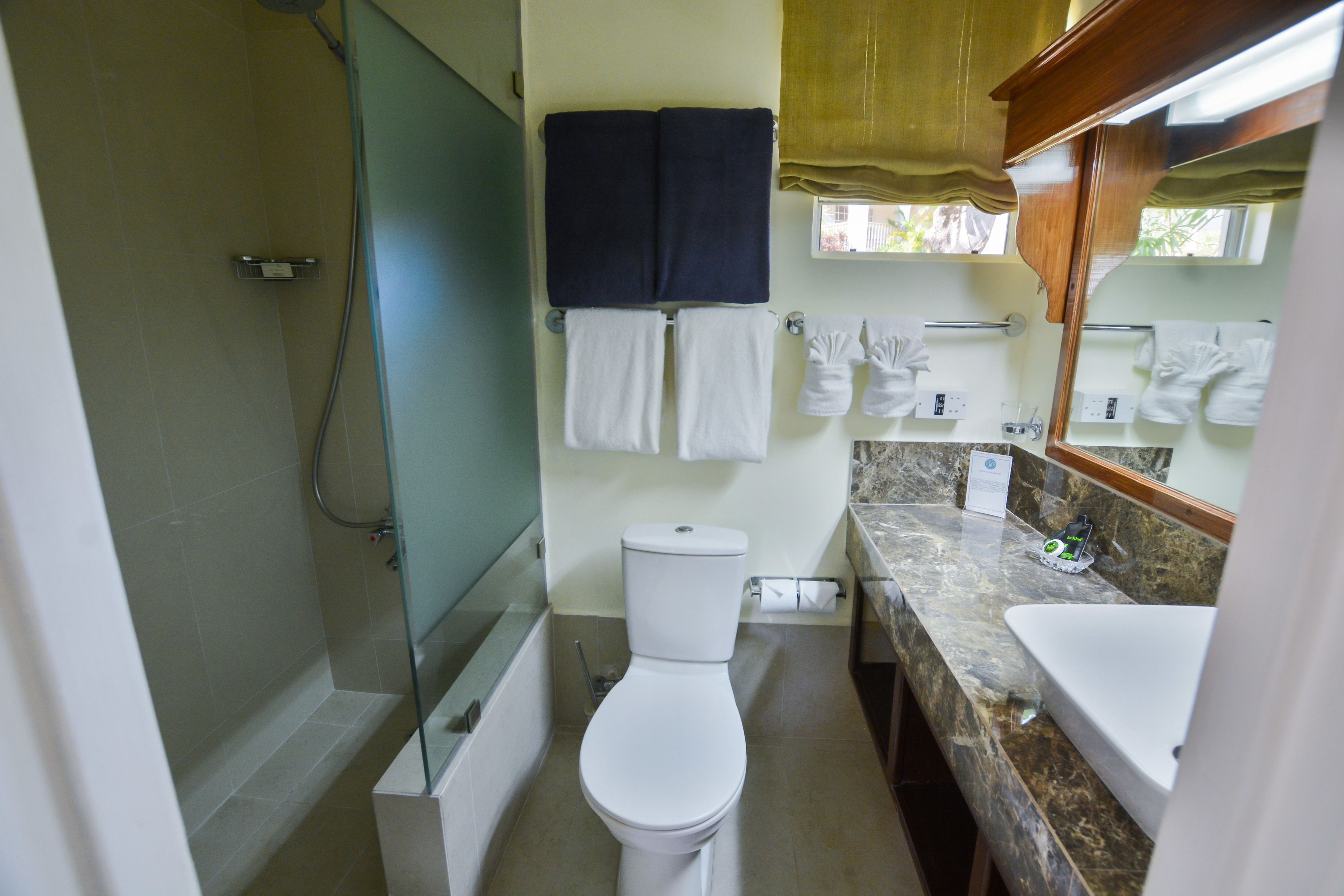 superior studio, 1 king bed, kitchenette, garden view | bathroom | eco-friendly toiletries, hair dryer, towels, soap