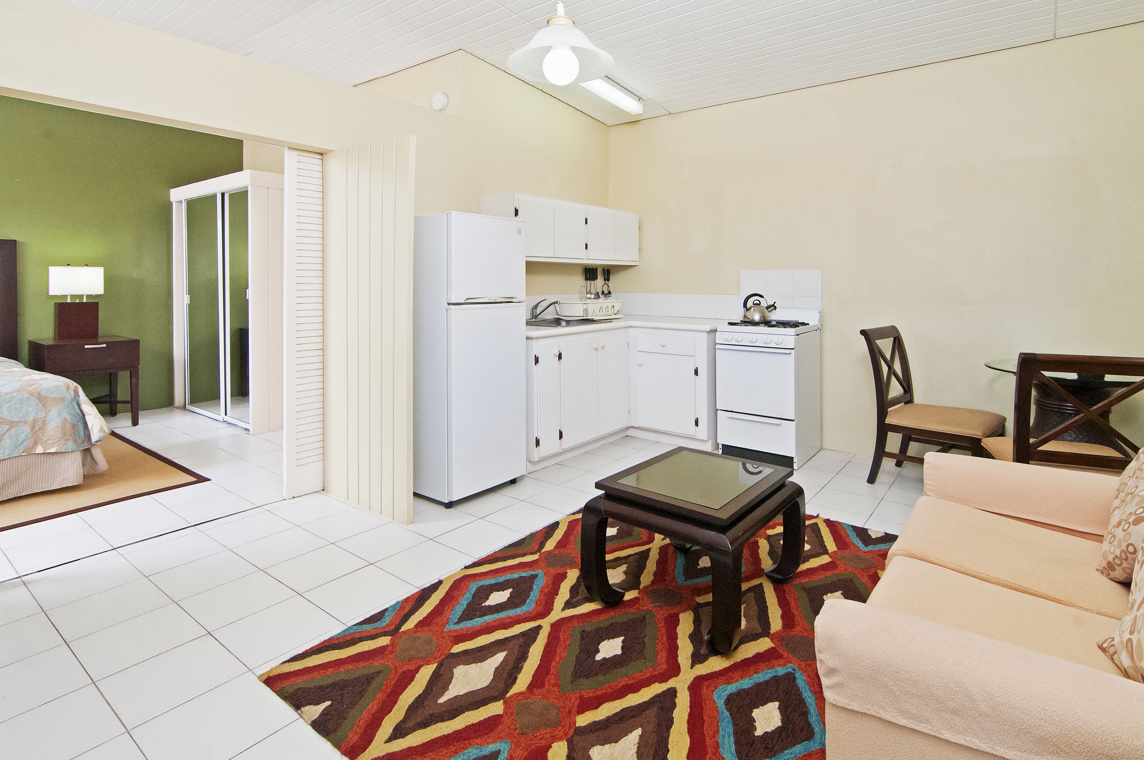 deluxe suite, 1 bedroom, kitchenette, ocean view | premium bedding, down duvets, in-room safe, individually furnished