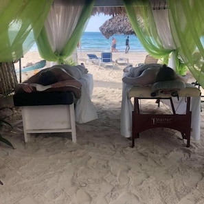 On the beach, sun-loungers, beach towels, beach bar