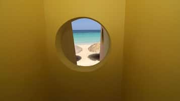 On the beach, sun-loungers, beach towels, beach bar