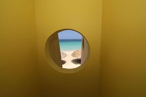 On the beach, sun-loungers, beach towels, beach bar