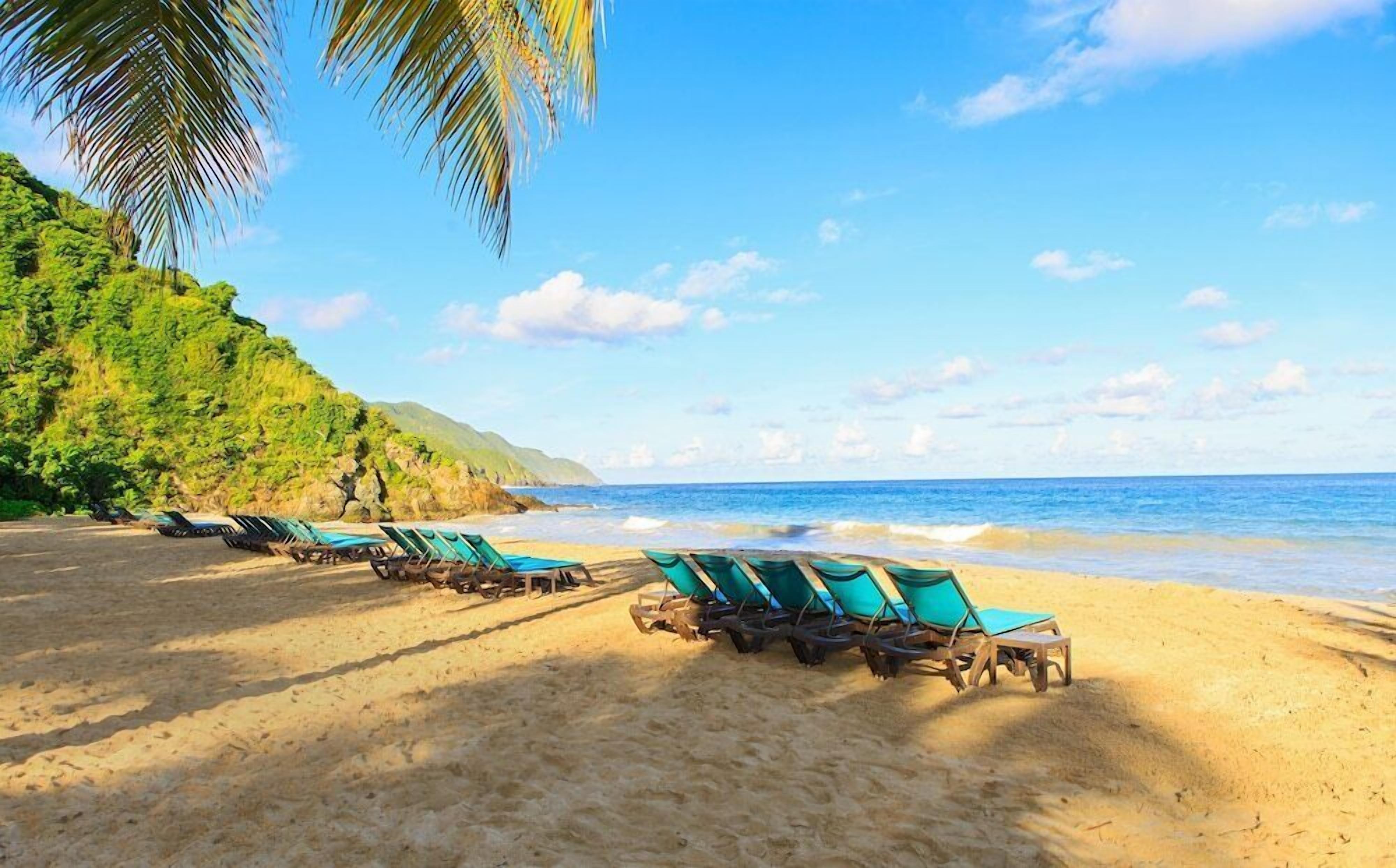 On the beach, sun-loungers, beach towels
