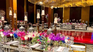 A formal dining area with tables set for service, featuring glassware, cutlery, and floral centerpieces. - The Westin Camino Real, Guatemala (Guatemala City)
