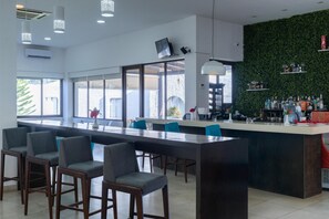 Pool views, serves dinner, brunch and happy hour
